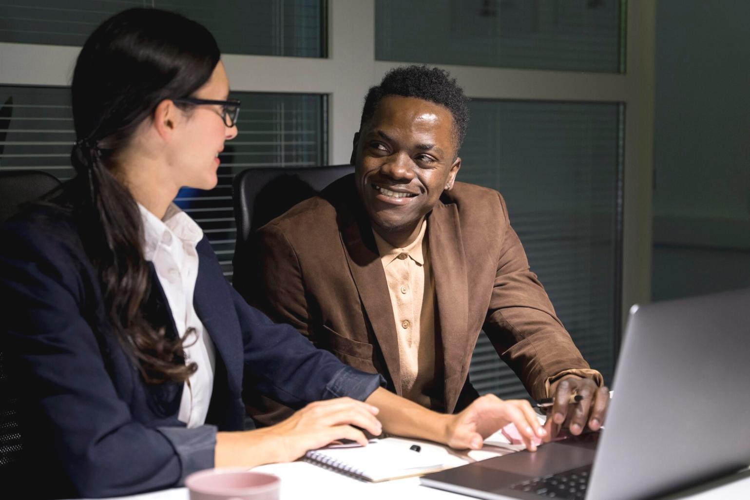 Financial market analysis charts and graphs displayed on multiple computer screens
