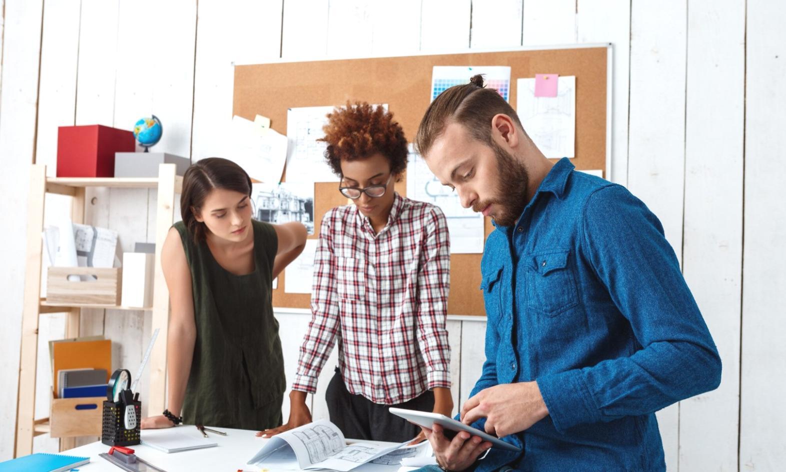 Diverse group of professionals engaged in collaborative learning about market strategies